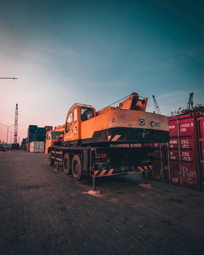 gallery-4 A bustling port with heavy machinery and containers during sunset in Tanjung Priok, Jakarta.